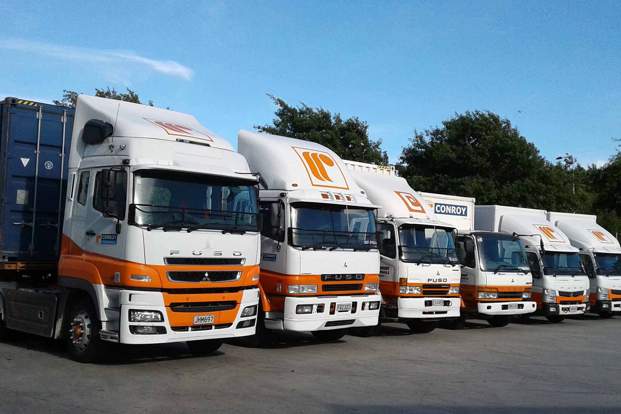 Conroy Removals employees next to a FUSO Shogun 