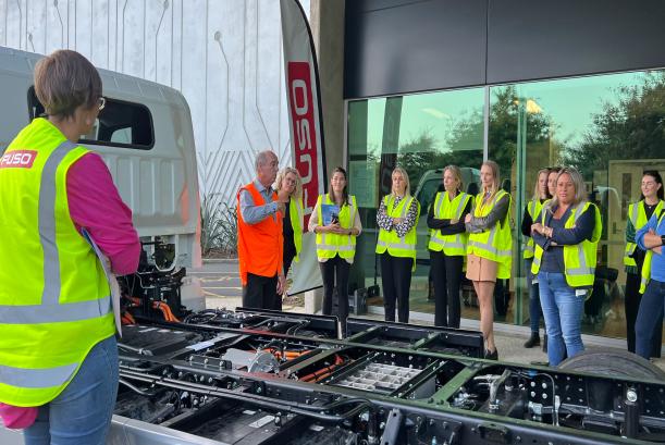 The Women of EVs New Zealand inspect a FUSO eCanter 